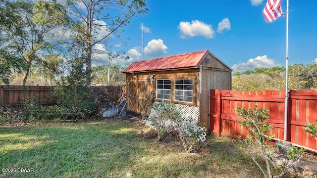 view of outbuilding featuring a lawn