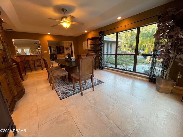 dining room featuring ceiling fan