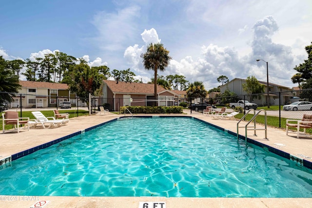 view of pool featuring a patio area