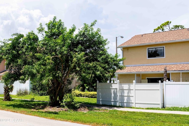 view of property exterior with a yard