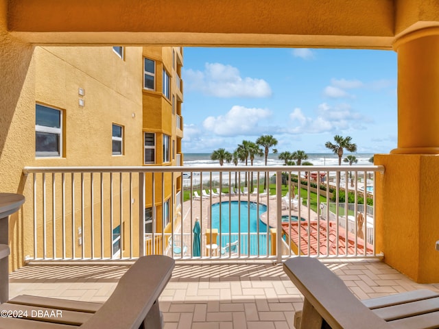 balcony featuring a water view