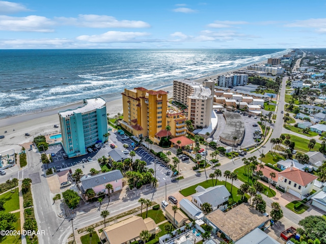 aerial view featuring a water view and a view of the beach