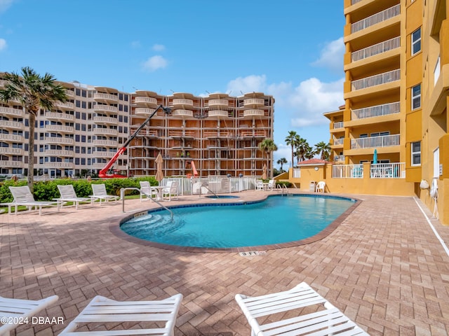 701 N Atlantic Ave Unit 202, New Smyrna Beach, FL 32169 - community pool featuring a patio area
