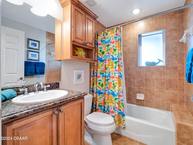 full bathroom with tile patterned floors, vanity, toilet, and shower / tub combo