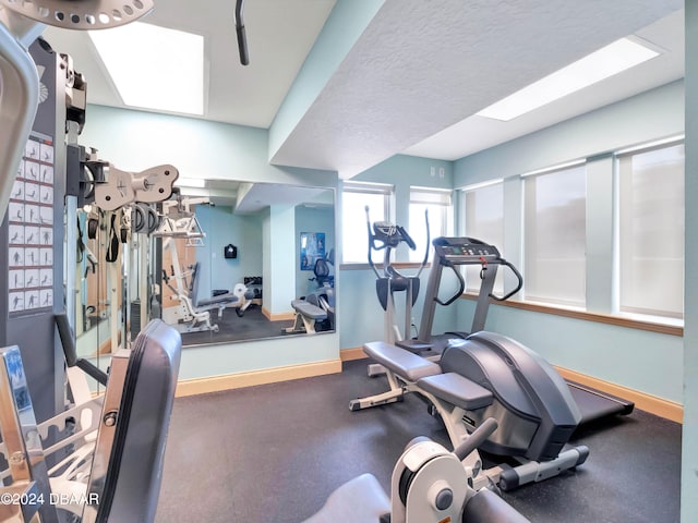 gym featuring a textured ceiling