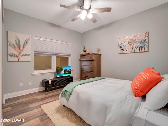 bedroom with ceiling fan and hardwood / wood-style floors