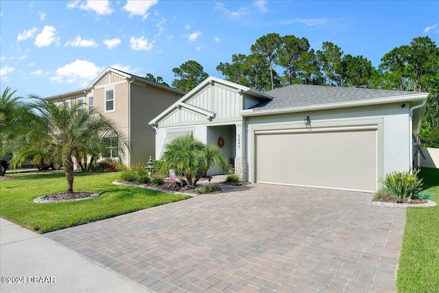 view of front facade featuring a garage and a front lawn