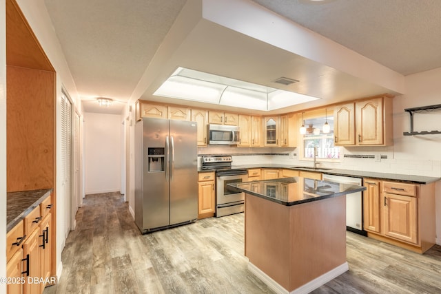 3643 Scott St, Port Orange, FL 32129 - kitchen featuring stainless steel appliances, light wood finished floors, light brown cabinetry, and glass insert cabinets