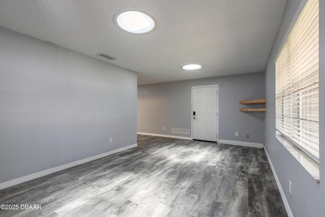 3643 Scott St, Port Orange, FL 32129 - unfurnished room with wood finished floors and a textured ceiling