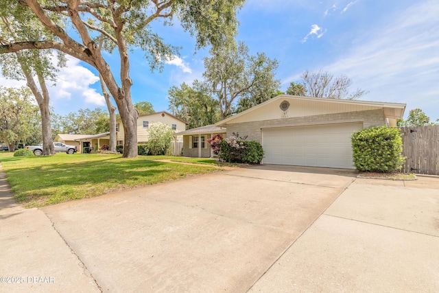 3643 Scott St, Port Orange, FL 32129 - view of front of house with a garage, concrete driveway, and brick siding