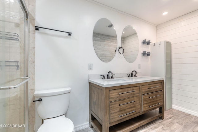 3643 Scott St, Port Orange, FL 32129 - full bathroom with wood walls, double vanity, wood finished floors, a stall shower, and recessed lighting