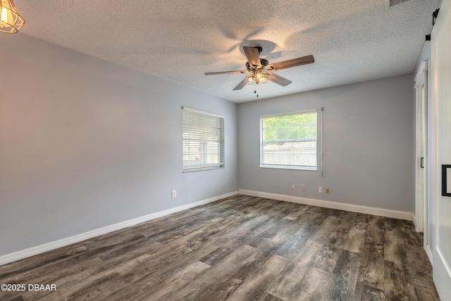 3643 Scott St, Port Orange, FL 32129 - spare room featuring dark wood-style flooring, a textured ceiling, and a ceiling fan