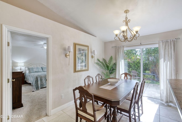 1465 Admiral Nimitz Ave, Daytona Beach, FL 32124 - dining area featuring lofted ceiling, light tile patterned floors, a chandelier, baseboards, and ceiling fan
