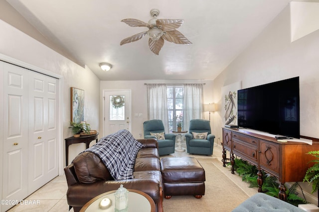 1465 Admiral Nimitz Ave, Daytona Beach, FL 32124 - living area with vaulted ceiling, light tile patterned flooring, and ceiling fan