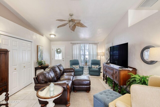 1465 Admiral Nimitz Ave, Daytona Beach, FL 32124 - living area with vaulted ceiling, a ceiling fan, and light tile patterned floors