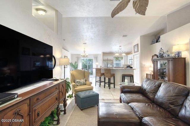 1465 Admiral Nimitz Ave, Daytona Beach, FL 32124 - living room featuring a chandelier, a ceiling fan, and light tile patterned flooring