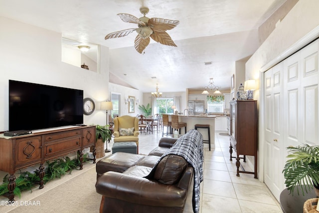 1465 Admiral Nimitz Ave, Daytona Beach, FL 32124 - living room featuring a chandelier, ceiling fan, vaulted ceiling, and light tile patterned floors