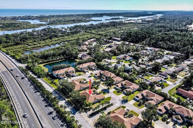 aerial view with a water view and a residential view