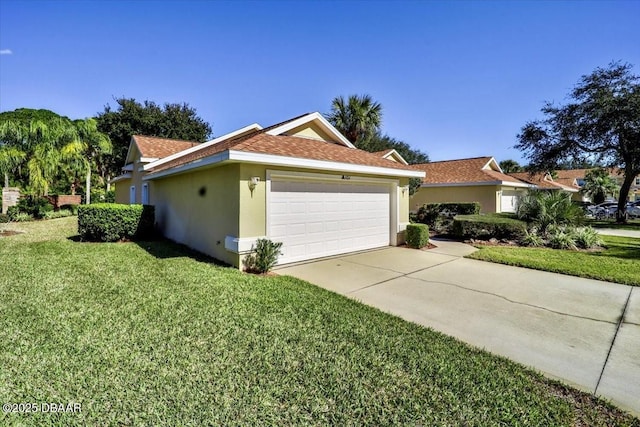 view of home's exterior featuring an attached garage, a yard, concrete driveway, and stucco siding