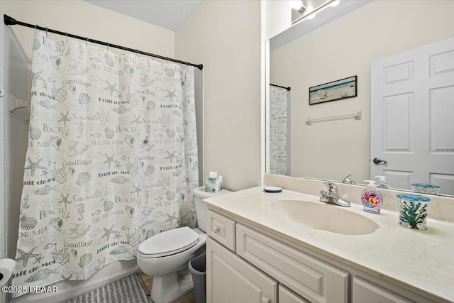 full bath featuring toilet, shower / bath combination with curtain, and vanity