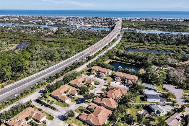 bird's eye view with a residential view and a water view