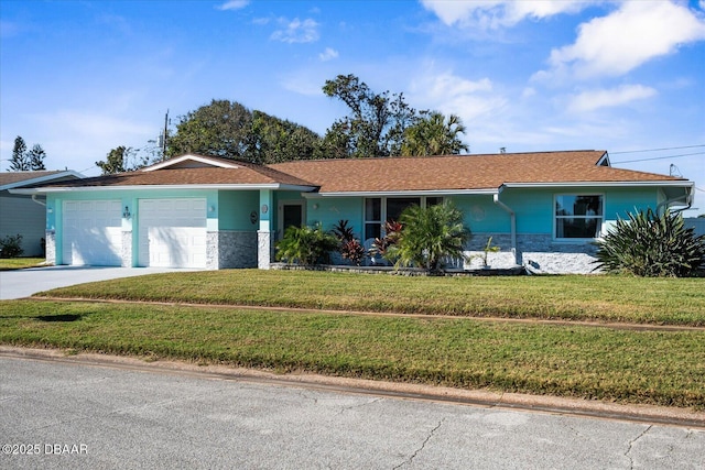 ranch-style house with a garage and a front lawn