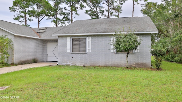 view of home's exterior with a lawn