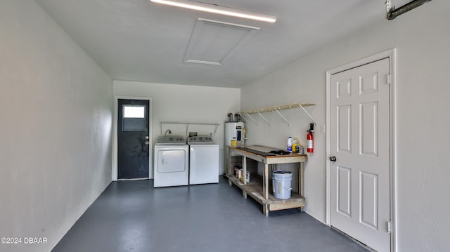 interior space featuring separate washer and dryer and electric water heater