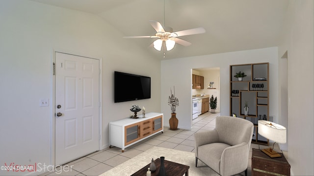 living room with lofted ceiling, light tile patterned floors, and ceiling fan