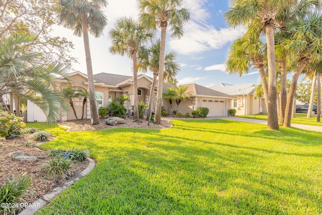 view of front of house featuring a garage and a front lawn