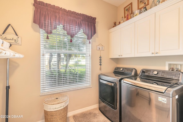 laundry area featuring cabinets and separate washer and dryer