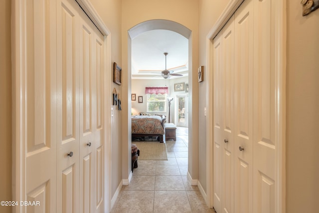 hall with light tile patterned floors