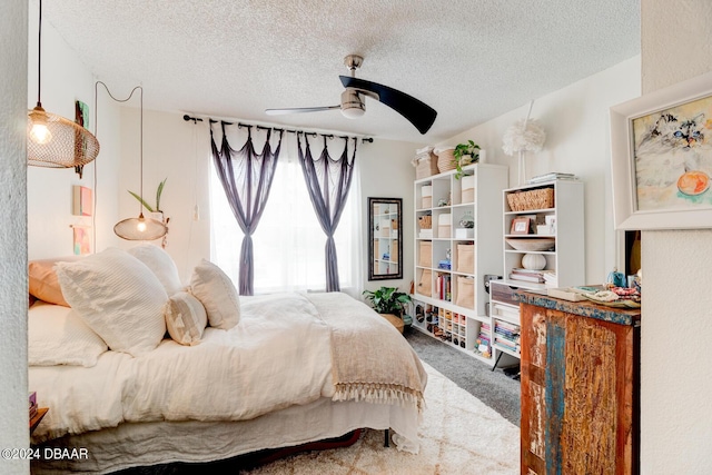 1600 Big Tree Rd Unit R4, Daytona Beach, FL 32119 - carpeted bedroom featuring a textured ceiling and ceiling fan