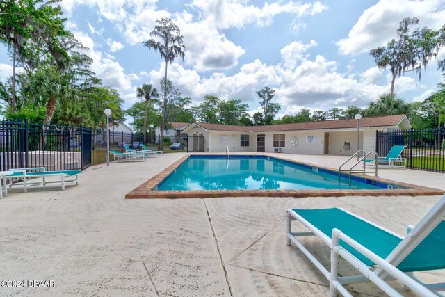 1600 Big Tree Rd Unit R4, Daytona Beach, FL 32119 - community pool with a patio area
