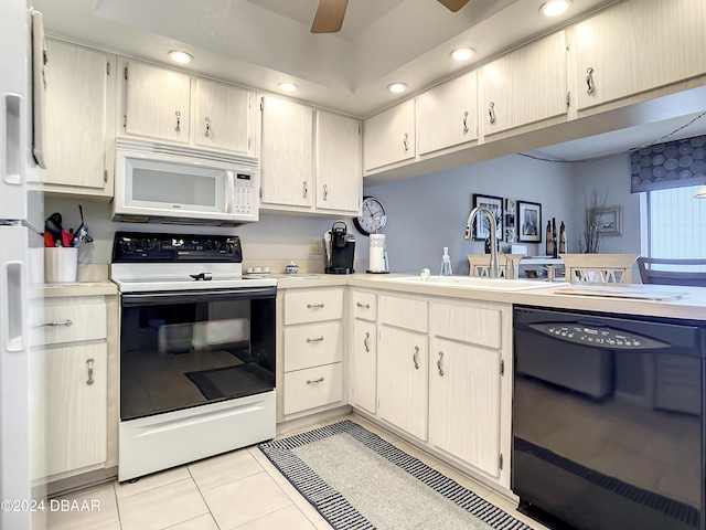 kitchen with ceiling fan, sink, kitchen peninsula, white appliances, and light tile patterned floors