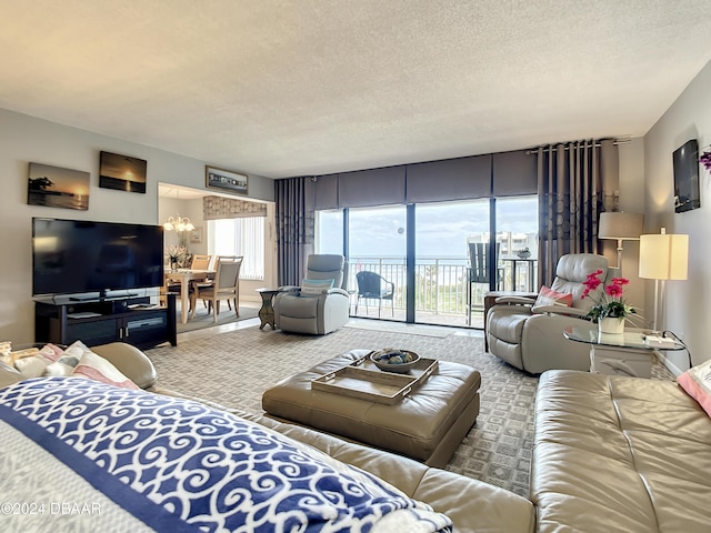 carpeted living room featuring a textured ceiling