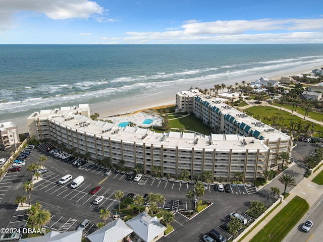 bird's eye view featuring a water view and a view of the beach