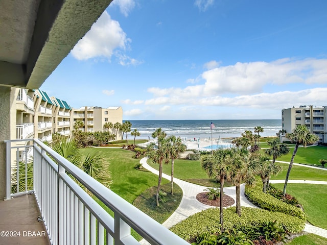 balcony featuring a water view and a view of the beach