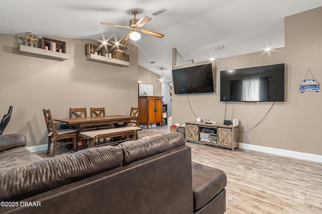 1724 Umbrella Tree Dr, Edgewater, FL 32132 - living area with ceiling fan, baseboards, vaulted ceiling, and wood finished floors