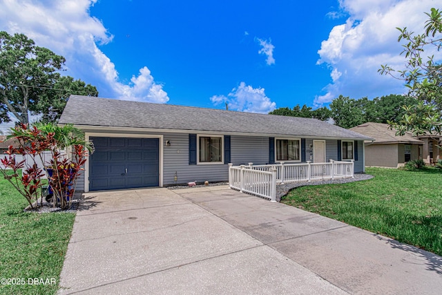 1724 Umbrella Tree Dr, Edgewater, FL 32132 - ranch-style home featuring a porch, a garage, driveway, and a front lawn