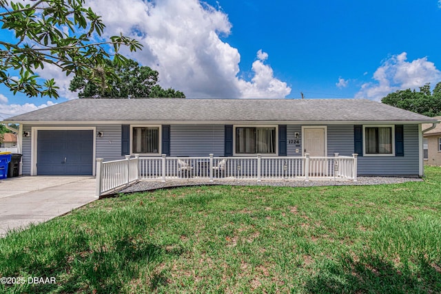 1724 Umbrella Tree Dr, Edgewater, FL 32132 - single story home with a porch, an attached garage, a front yard, and driveway