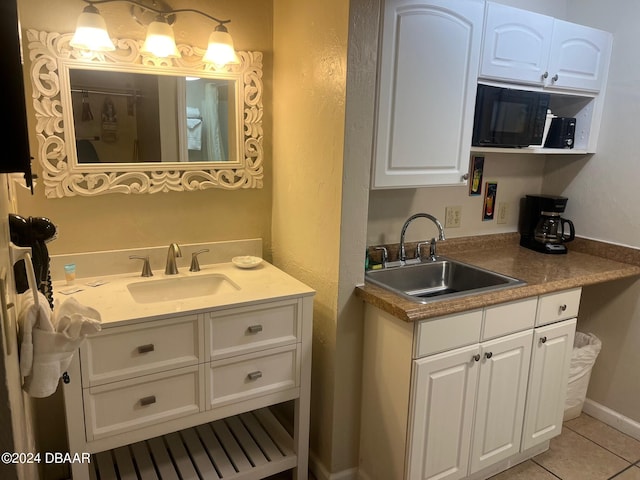 bathroom featuring tile patterned floors and vanity