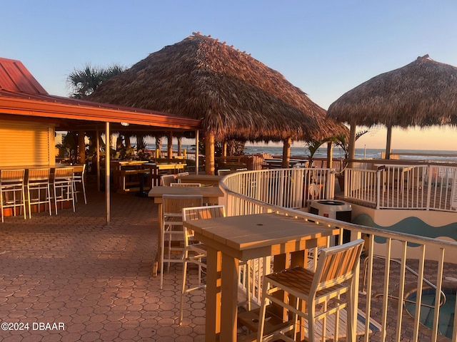 exterior space featuring a gazebo, cooling unit, and a bar