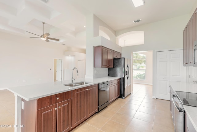 kitchen with decorative backsplash, appliances with stainless steel finishes, sink, and light tile patterned floors