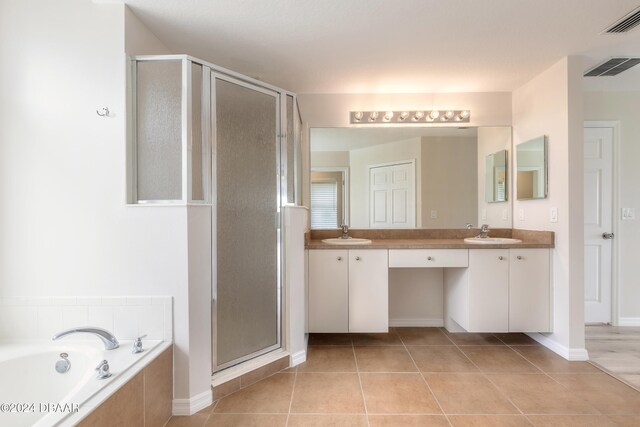 bathroom with vanity, tile patterned floors, and independent shower and bath