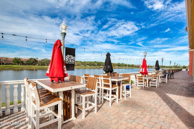 view of patio with a water view