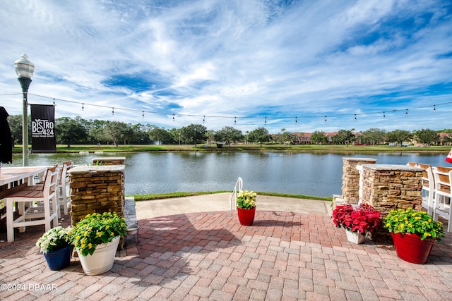 view of patio / terrace featuring a water view