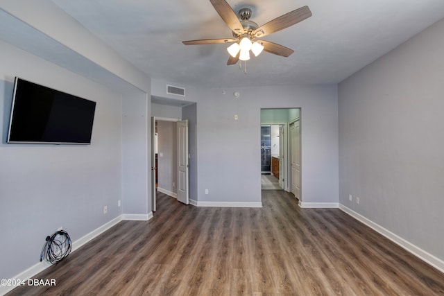 empty room featuring ceiling fan and dark hardwood / wood-style flooring