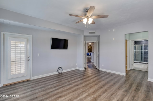 unfurnished living room featuring hardwood / wood-style floors and ceiling fan