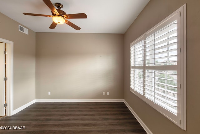 spare room featuring ceiling fan and dark hardwood / wood-style floors